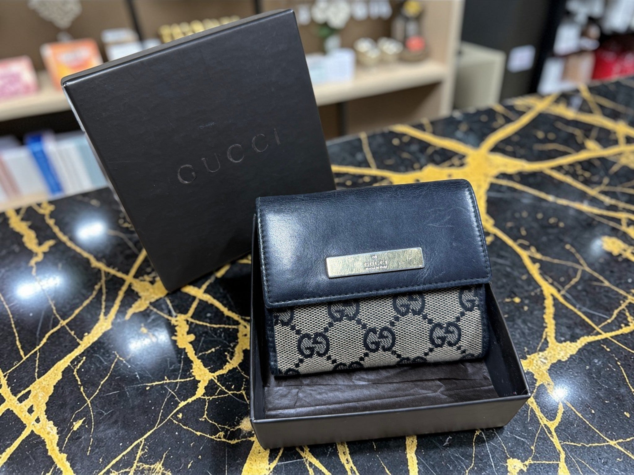 Gucci GG Supreme Canvas Geldbörse mit schwarzem Lederbesatz