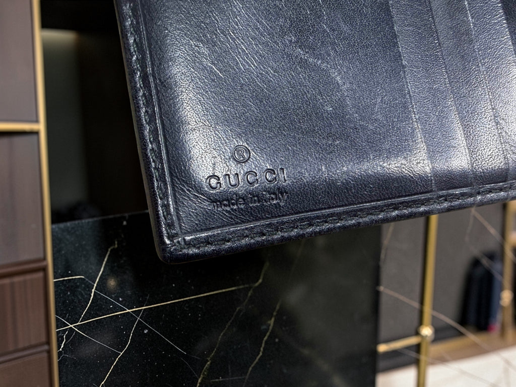 Gucci GG Supreme Canvas Bifold Wallet with Black Leather Trim