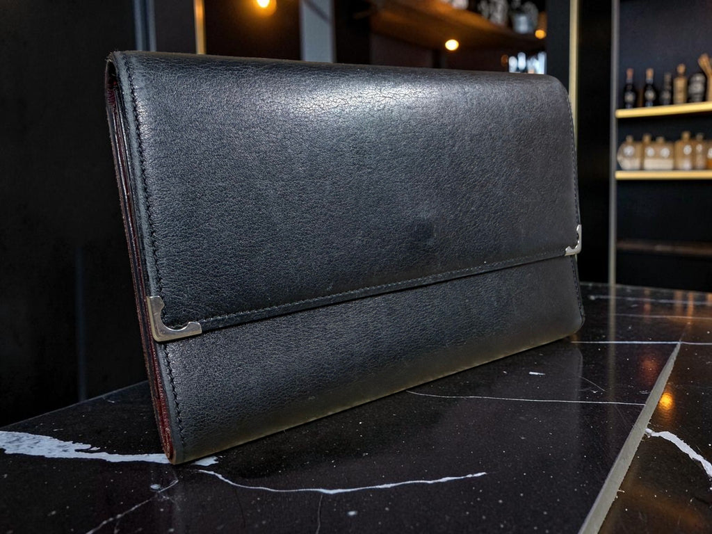 Cartier Cabochon Leather International Flap Wallet (Black with Red Interior).