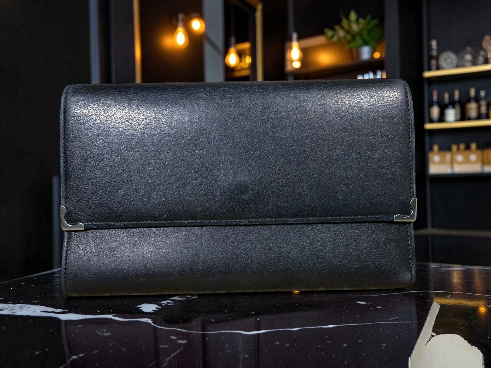 Cartier Cabochon Leather International Flap Wallet (Black with Red Interior).