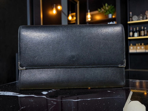 Cartier Cabochon Leather International Flap Wallet (Black with Red Interior).