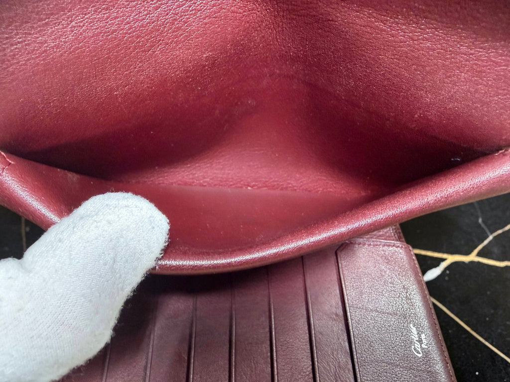Cartier Cabochon Leather International Flap Wallet (Black with Red Interior).