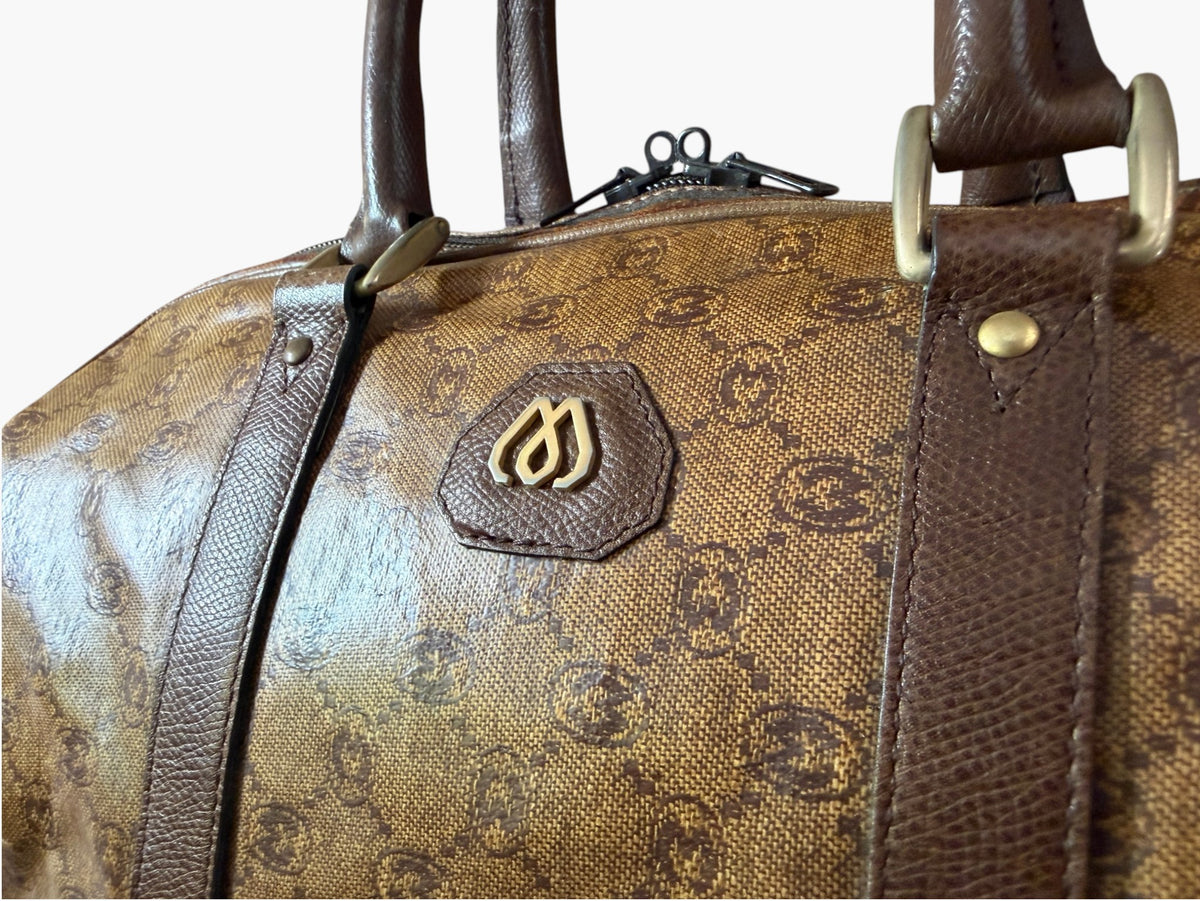 Morabito monogram duffle bag, close-up of crest badge