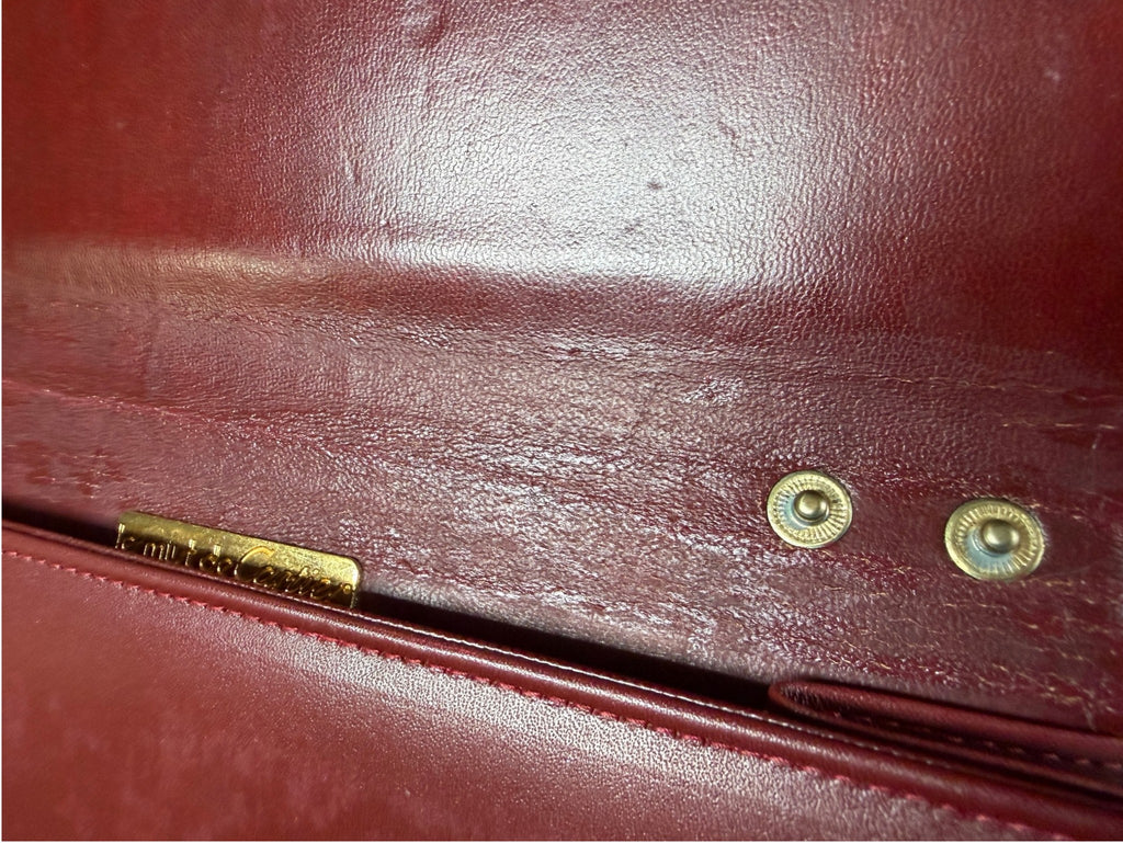 Close-up of magnetic clasp on Cartier clutch