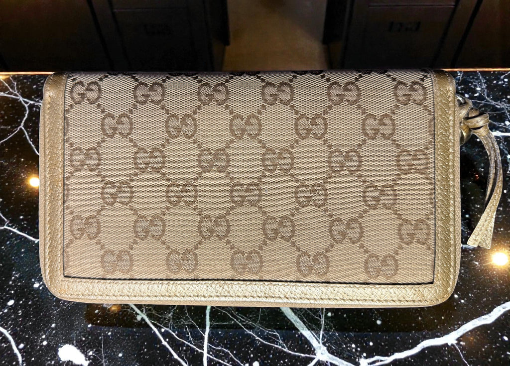 Portefeuille long Continental Gucci en toile GG et cuir doré couleur champagne