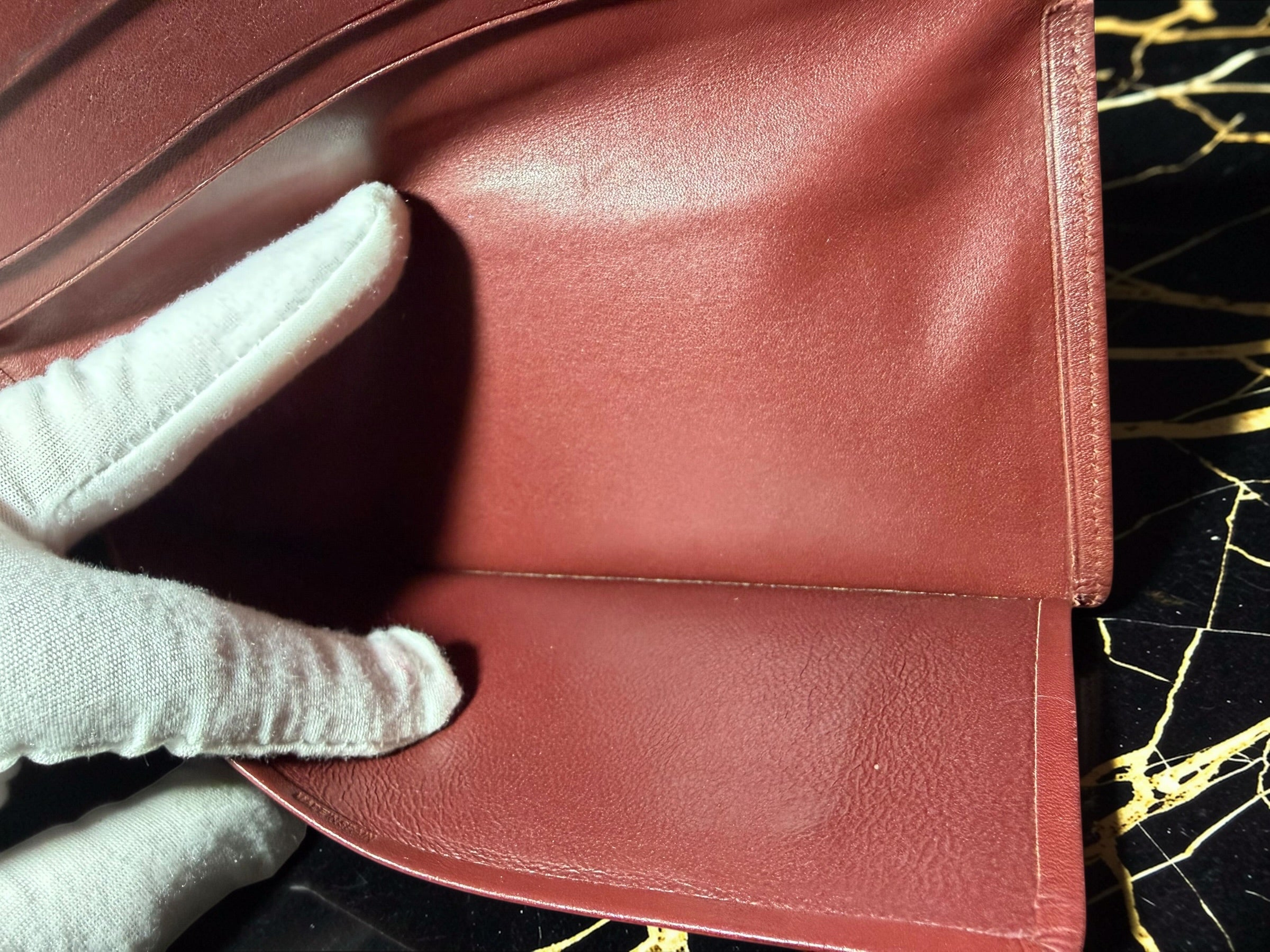 Portefeuille long Must de Cartier en cuir de veau