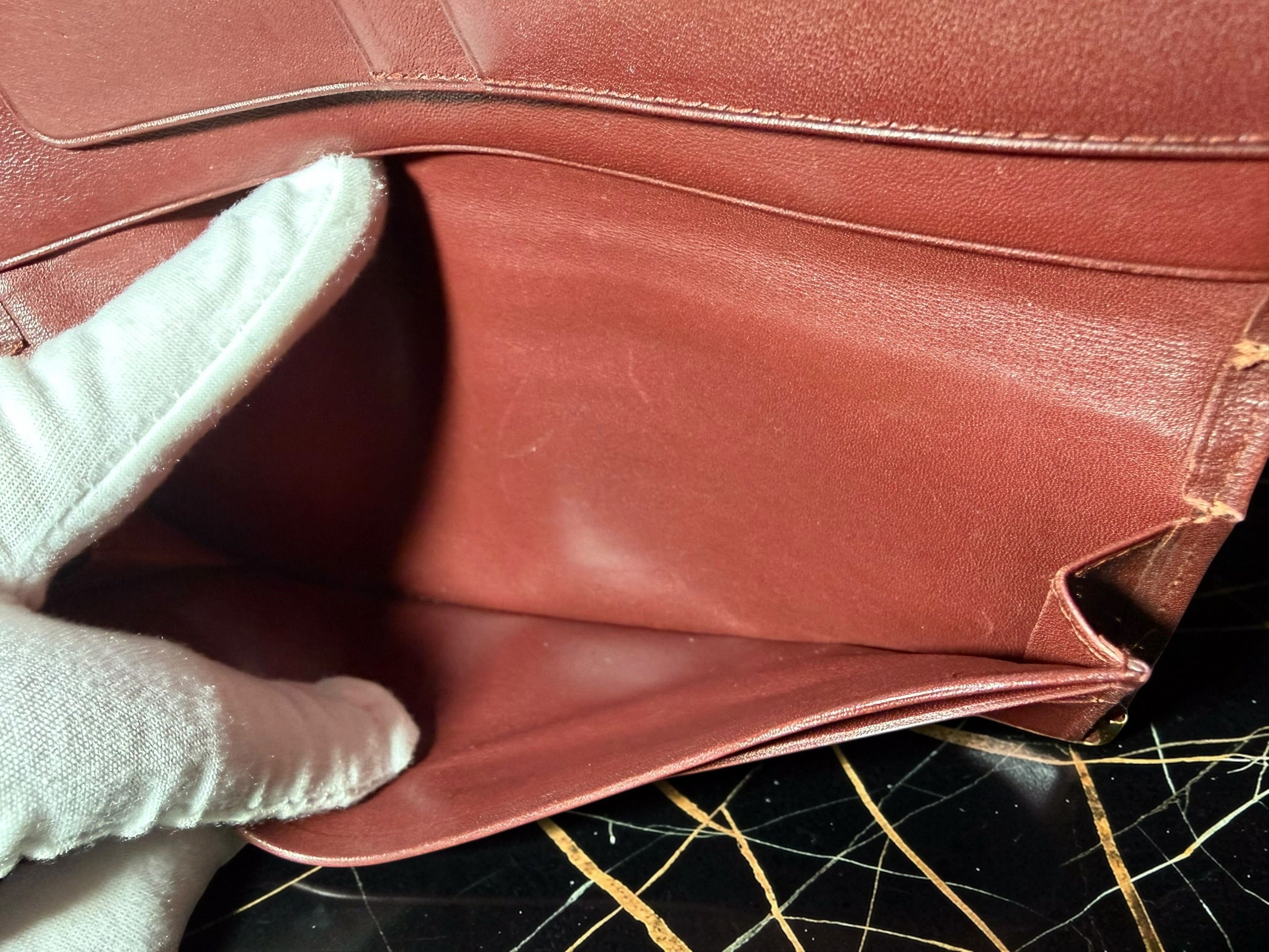 Portefeuille long Must de Cartier en cuir de veau