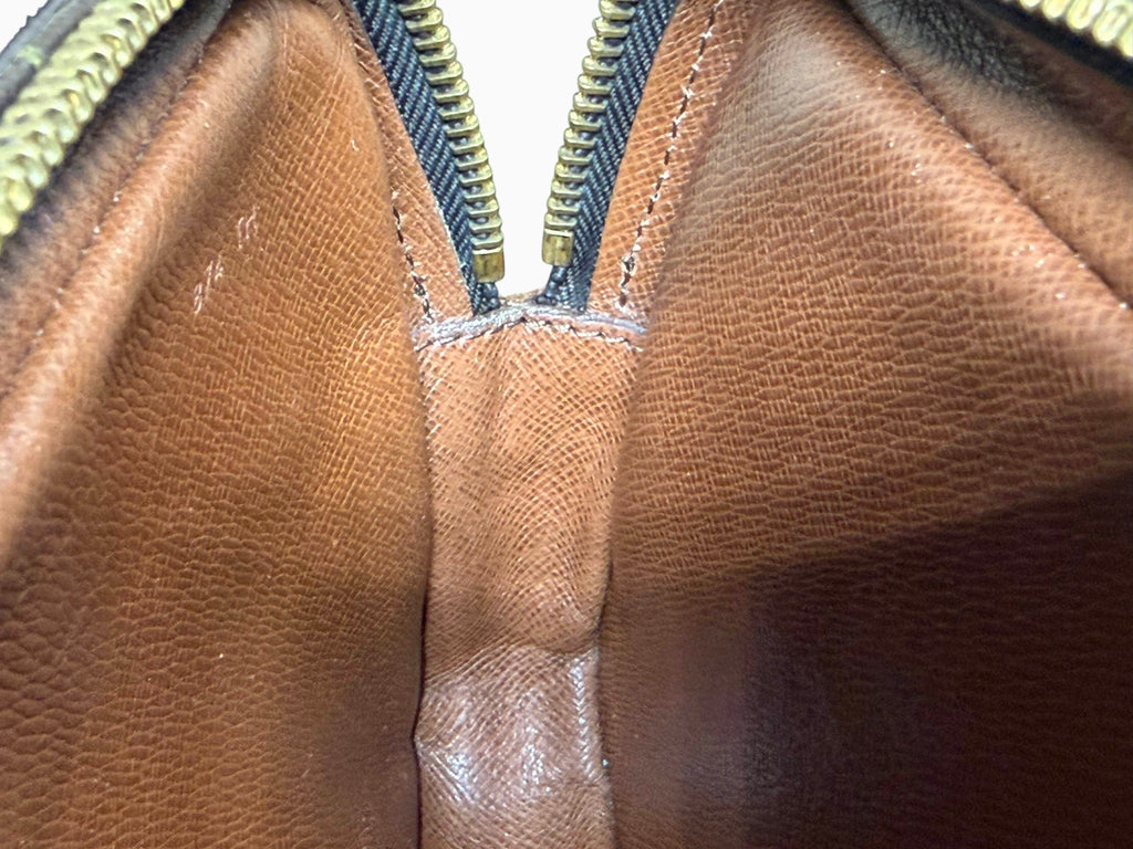 newtoyouluxuries vintage Louis Vuitton Pochette Marly interior showing clean brown leather lining and date code 874 TH