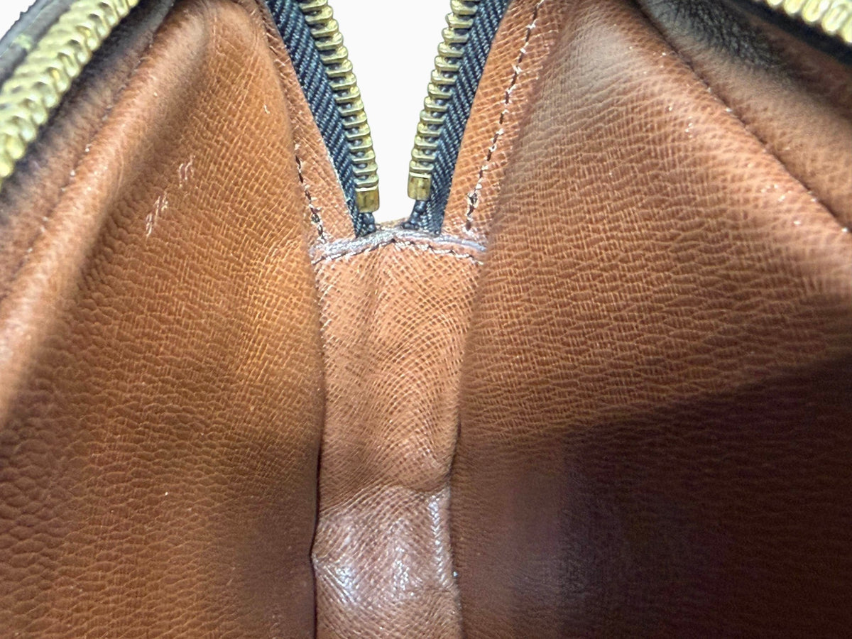 newtoyouluxuries vintage Louis Vuitton Pochette Marly interior showing clean brown leather lining and date code 874 TH