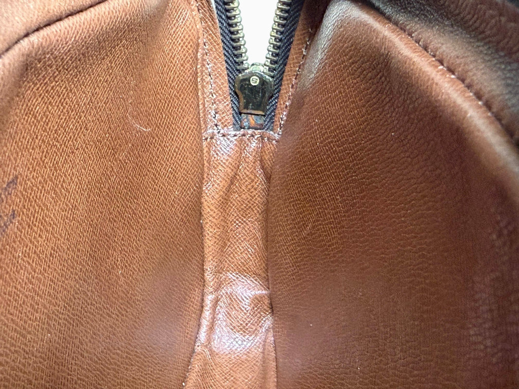 newtoyouluxuries vintage Louis Vuitton Pochette Marly interior showing clean brown leather lining and zipper detail