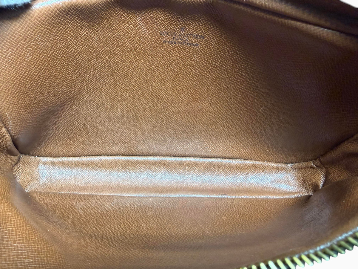 Interior of vintage newtoyouluxuries Louis Vuitton Pochette Marly bag showing clean brown leather lining and LV stamp